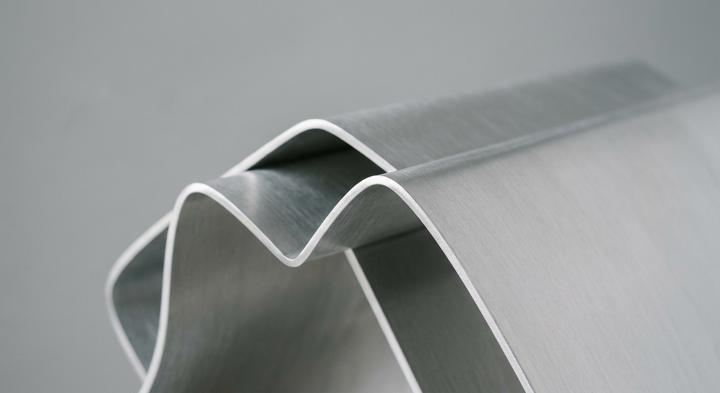 Close-up of clean and precise geometric bends in a modern aluminum sheet metal component