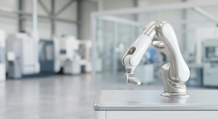 A modern clean-room style industrial manufacturing facility with high-precision equipment
